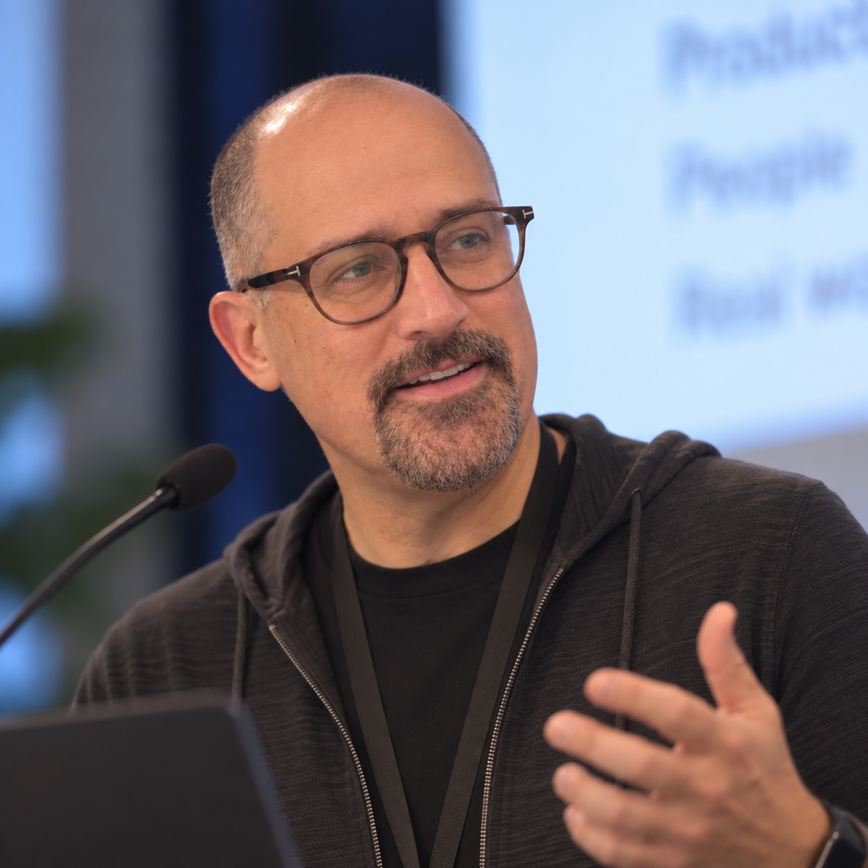 Kal Walkden speaking at a conference.